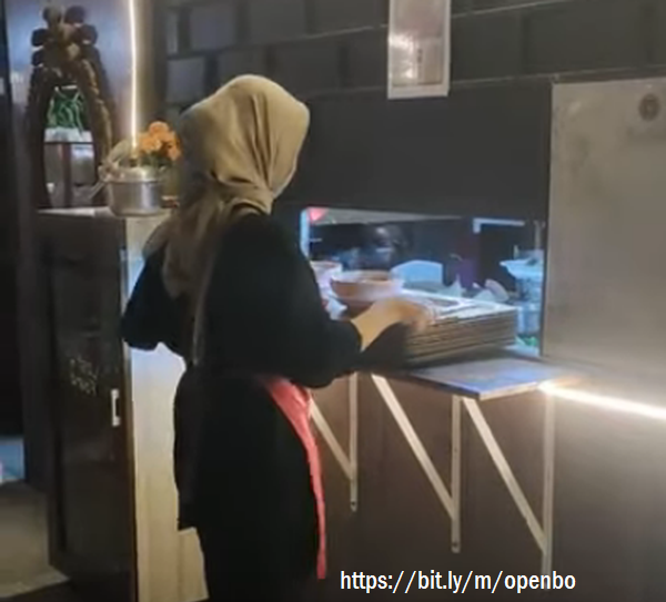 Soraya Pepe, hijaber girl, a cafe waitress, serves every customer who comes in